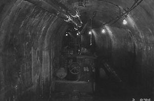 Locomotive 508 resting against the north wall of the tunnel